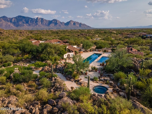 birds eye view of property featuring a mountain view