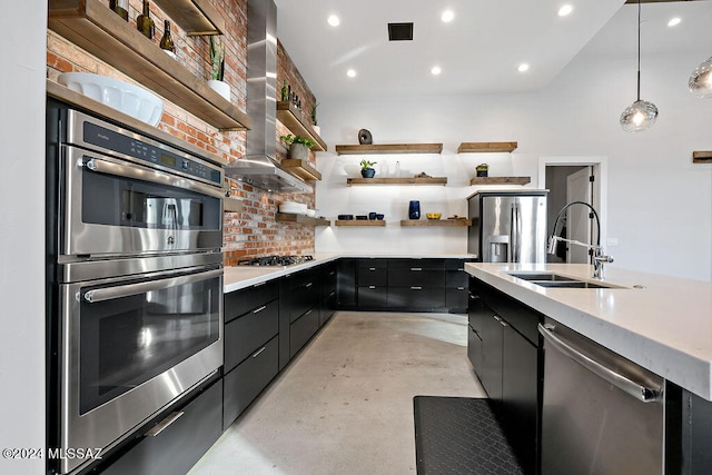 kitchen with wall chimney exhaust hood, pendant lighting, stainless steel appliances, sink, and decorative backsplash