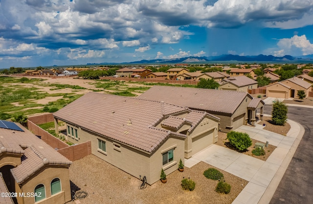 birds eye view of property featuring a mountain view