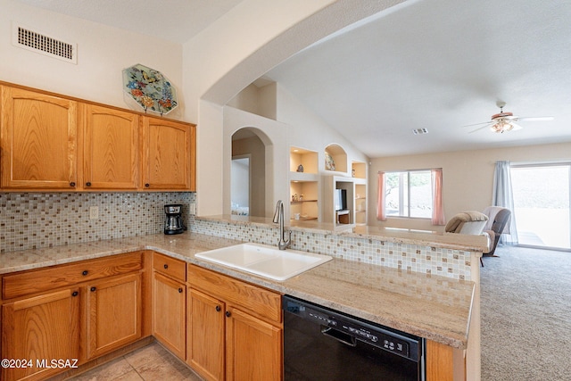 kitchen featuring light carpet, dishwasher, kitchen peninsula, sink, and lofted ceiling