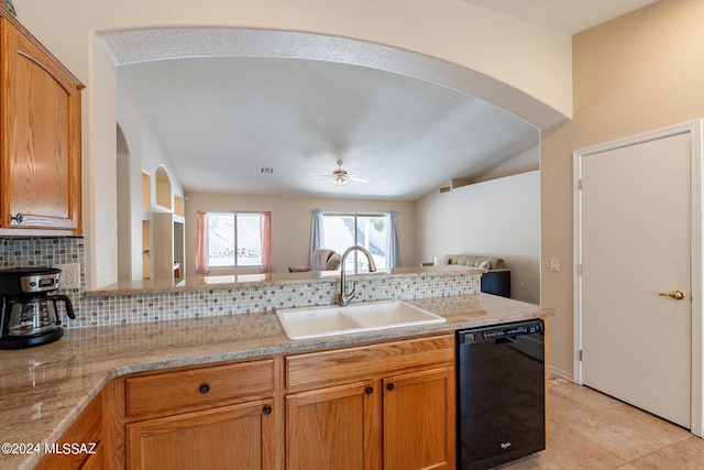 kitchen featuring dishwasher, vaulted ceiling, sink, kitchen peninsula, and decorative backsplash