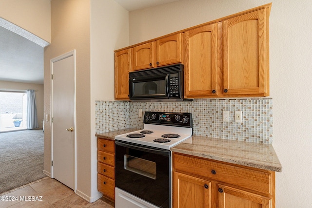 kitchen featuring white electric stove, light colored carpet, light stone countertops, and backsplash