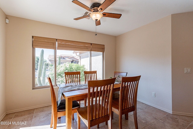 dining room featuring light tile patterned floors and ceiling fan