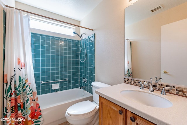 bathroom featuring visible vents, toilet, vanity, shower / tub combo, and backsplash