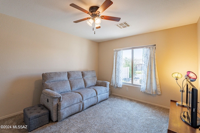 living room featuring ceiling fan and carpet floors