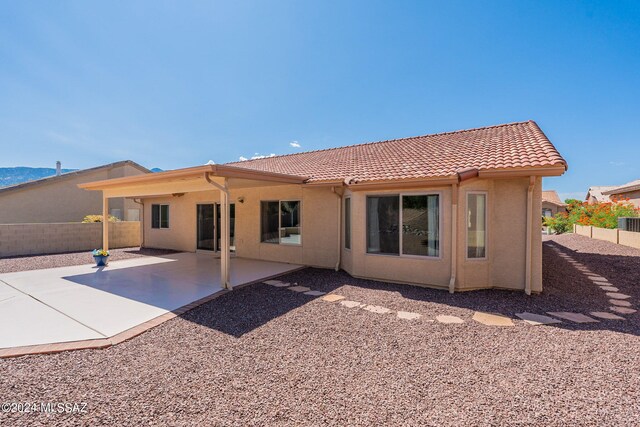 rear view of house with a patio