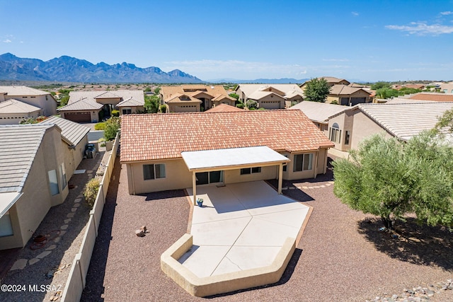 drone / aerial view featuring a residential view and a mountain view