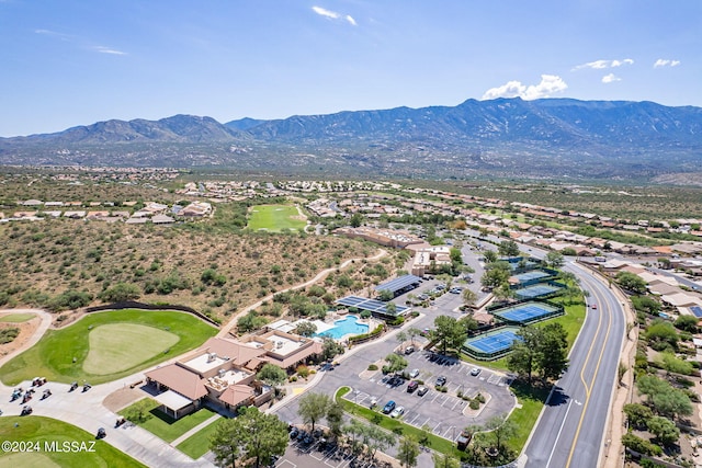 aerial view featuring golf course view and a mountain view
