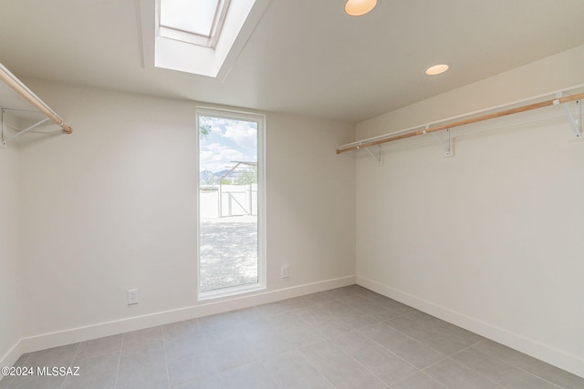 walk in closet with a skylight