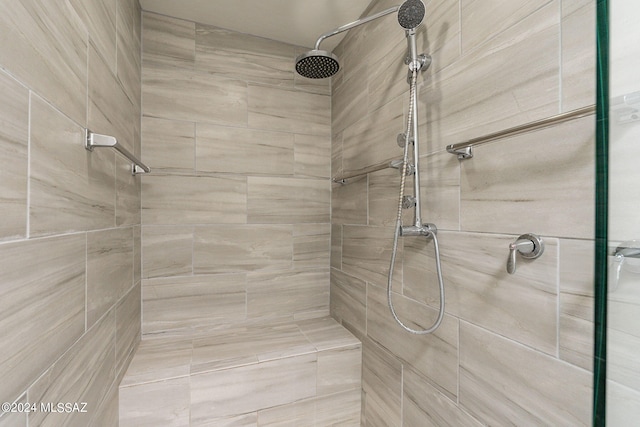 bathroom with a tile shower