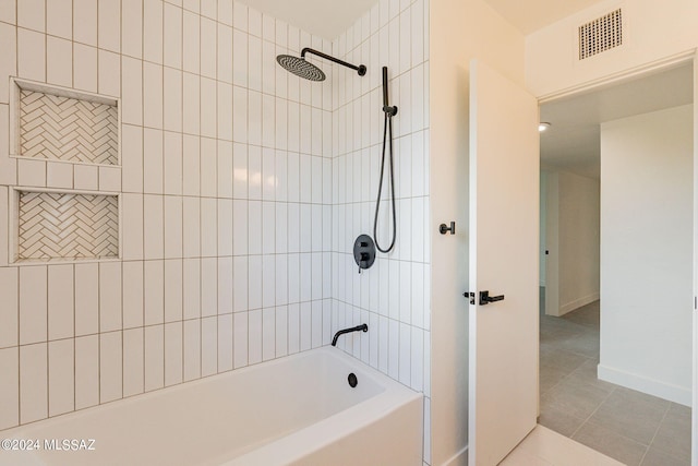 bathroom featuring tile patterned flooring, visible vents, and baseboards