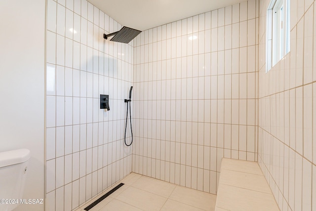 full bathroom with toilet and tiled shower