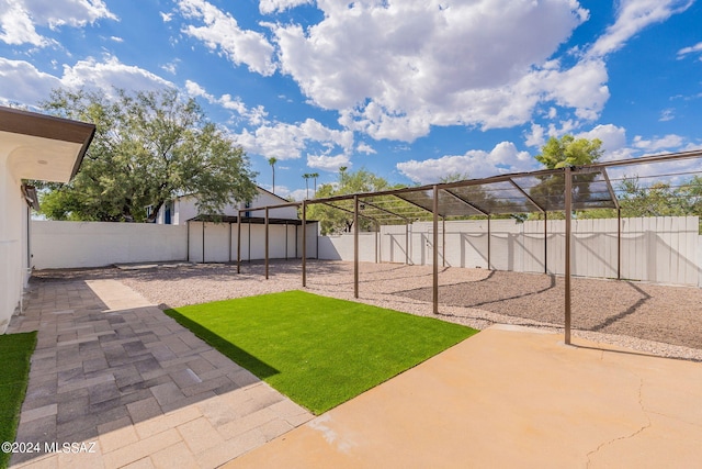 view of yard featuring a patio area and a fenced backyard