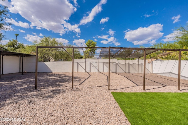 view of playground featuring a lawn and a fenced backyard