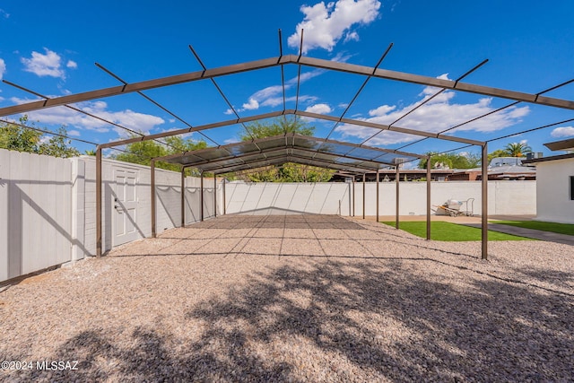 exterior space with a patio, a fenced backyard, and a gate