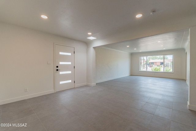 entrance foyer featuring baseboards and recessed lighting