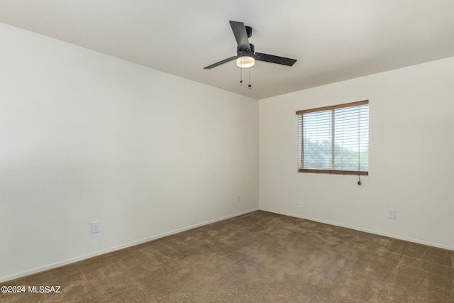 unfurnished room with ceiling fan, carpet, and baseboards