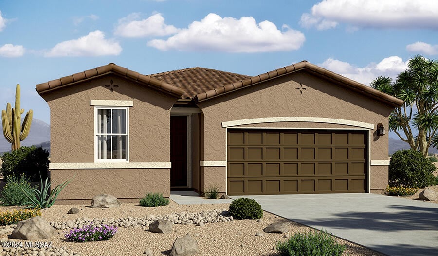 view of front facade featuring stucco siding, a tiled roof, driveway, and a garage