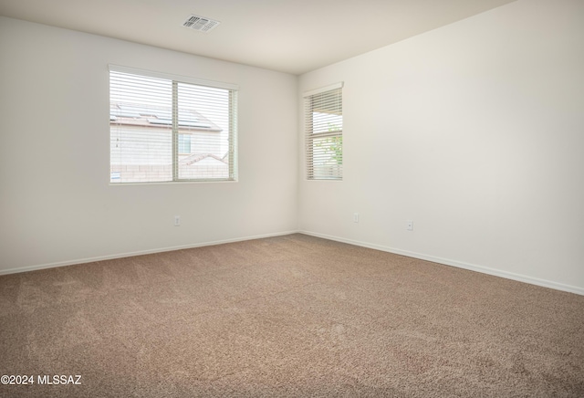 243 E Refuge Loop, Vail, AZ 85641 - carpeted spare room featuring baseboards and visible vents