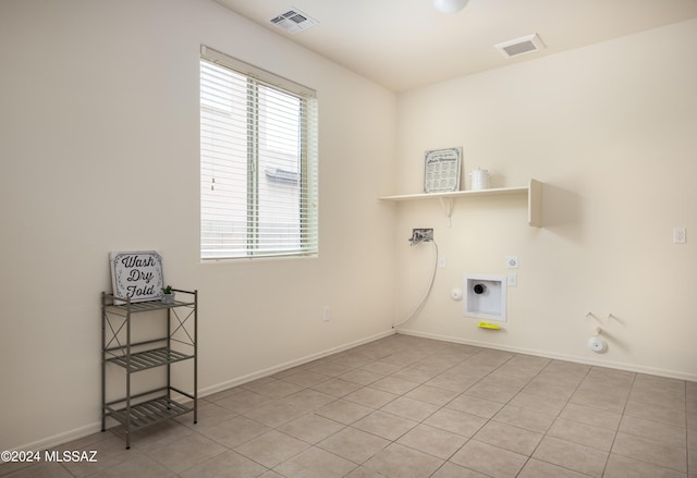 clothes washing area featuring hookup for a gas dryer, laundry area, visible vents, and electric dryer hookup