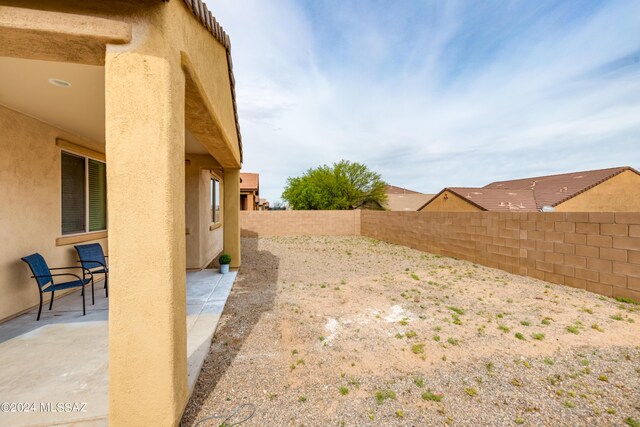 view of yard with a patio area and a fenced backyard