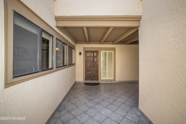 doorway to property featuring a patio area