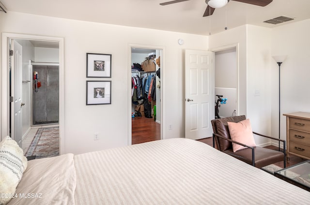 bedroom with a closet, a spacious closet, and ceiling fan