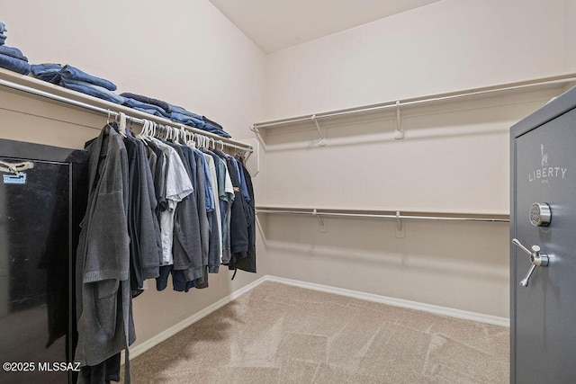 walk in closet featuring carpet