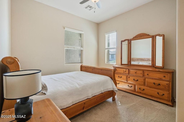 bedroom with ceiling fan and visible vents