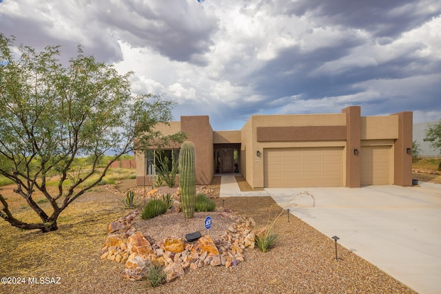 adobe home featuring a garage