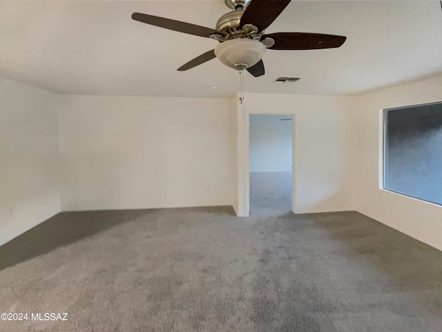 spare room with ceiling fan and carpet floors