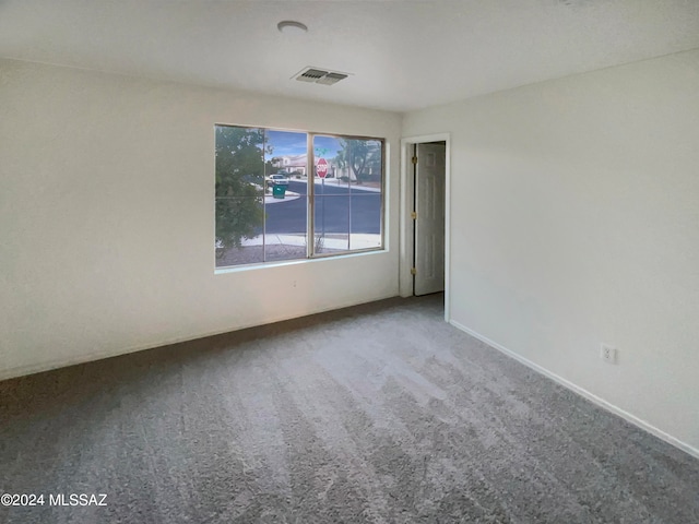 spare room featuring carpet