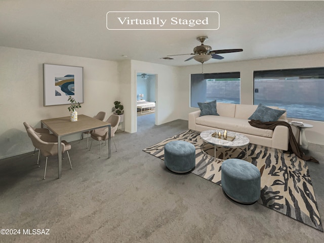 living room featuring ceiling fan and carpet flooring