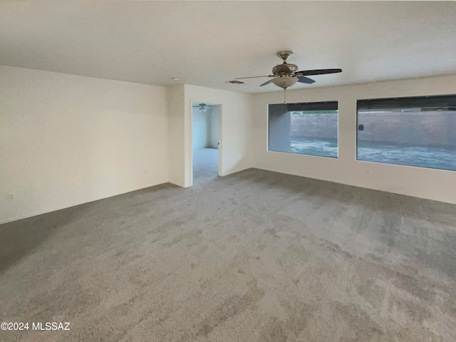 interior space with ceiling fan and carpet floors