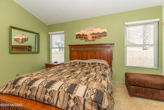 bedroom with lofted ceiling