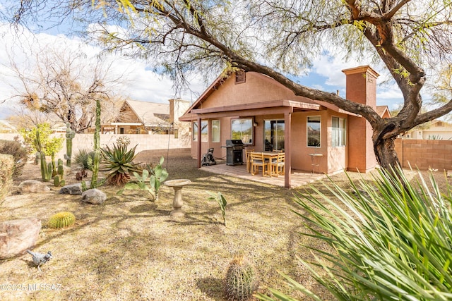 rear view of house with a patio area