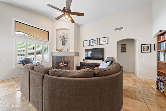 living room featuring ceiling fan and light tile patterned flooring