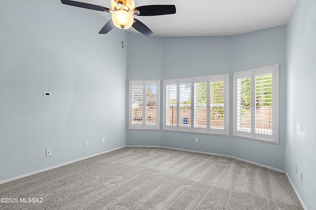 9797 E Holden Pl, Tucson, AZ 85748 - spare room with carpet, a ceiling fan, and a high ceiling