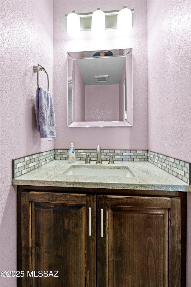 9797 E Holden Pl, Tucson, AZ 85748 - bathroom featuring vanity and a textured wall