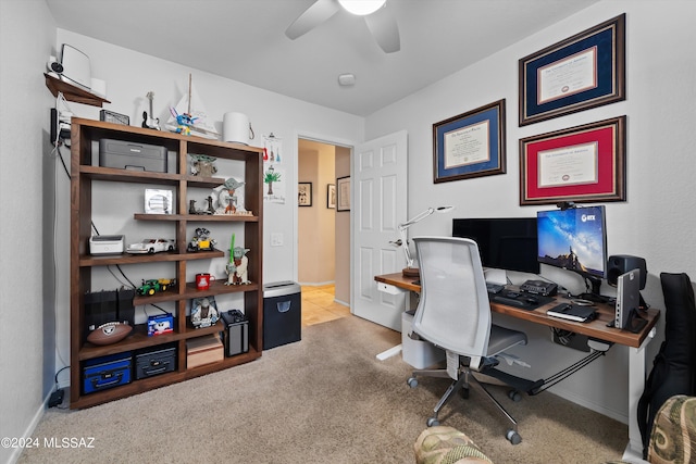 office area featuring ceiling fan and light carpet