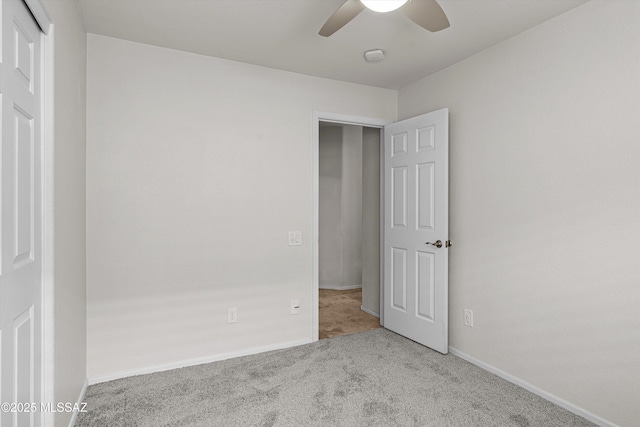 9797 E Holden Pl, Tucson, AZ 85748 - unfurnished bedroom featuring carpet floors, a closet, and ceiling fan