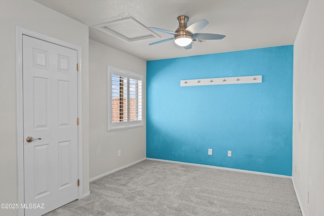 9797 E Holden Pl, Tucson, AZ 85748 - unfurnished bedroom featuring carpet, attic access, and ceiling fan