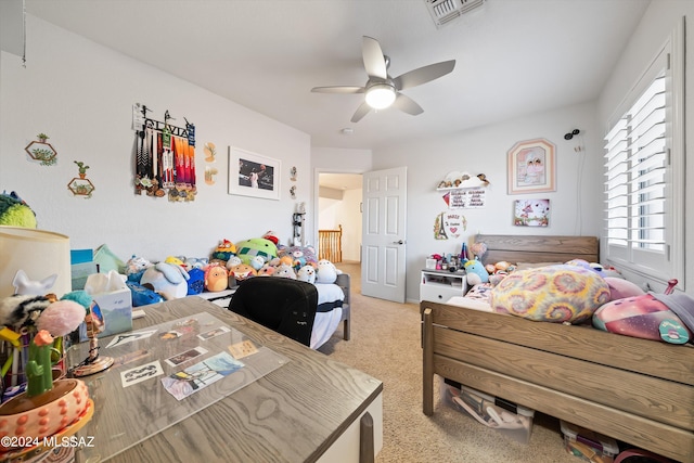 carpeted bedroom featuring ceiling fan