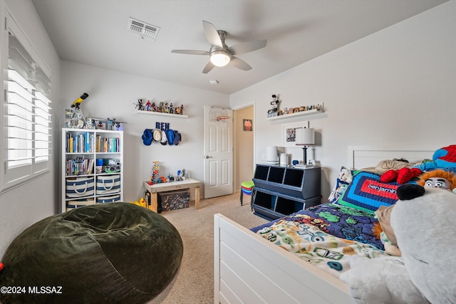 carpeted bedroom featuring ceiling fan