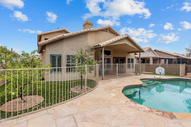 9797 E Holden Pl, Tucson, AZ 85748 - rear view of house with a chimney, a patio area, stucco siding, and a tile roof
