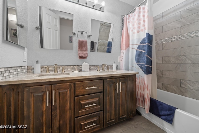 bathroom with vanity, tasteful backsplash, shower / bath combo, and tile patterned flooring