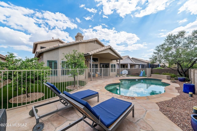 view of swimming pool featuring a patio area