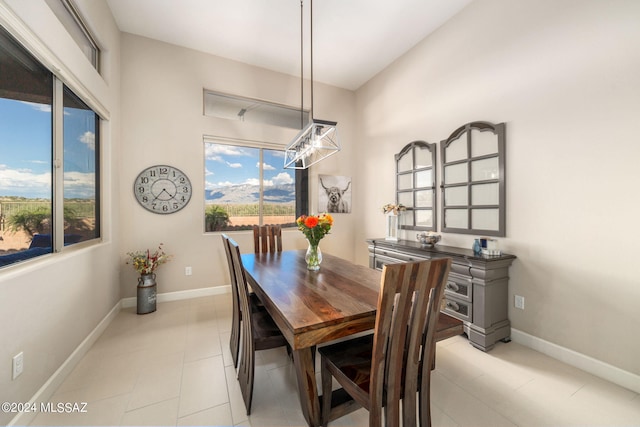 dining area featuring light tile patterned floors