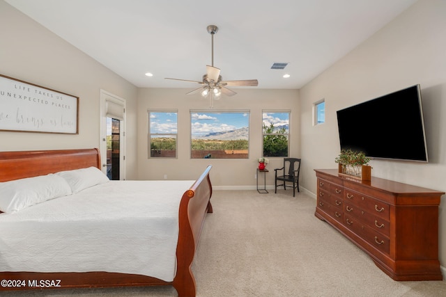 carpeted bedroom with ceiling fan