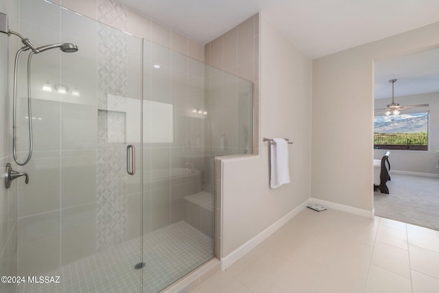 bathroom with ceiling fan, tile patterned flooring, and an enclosed shower